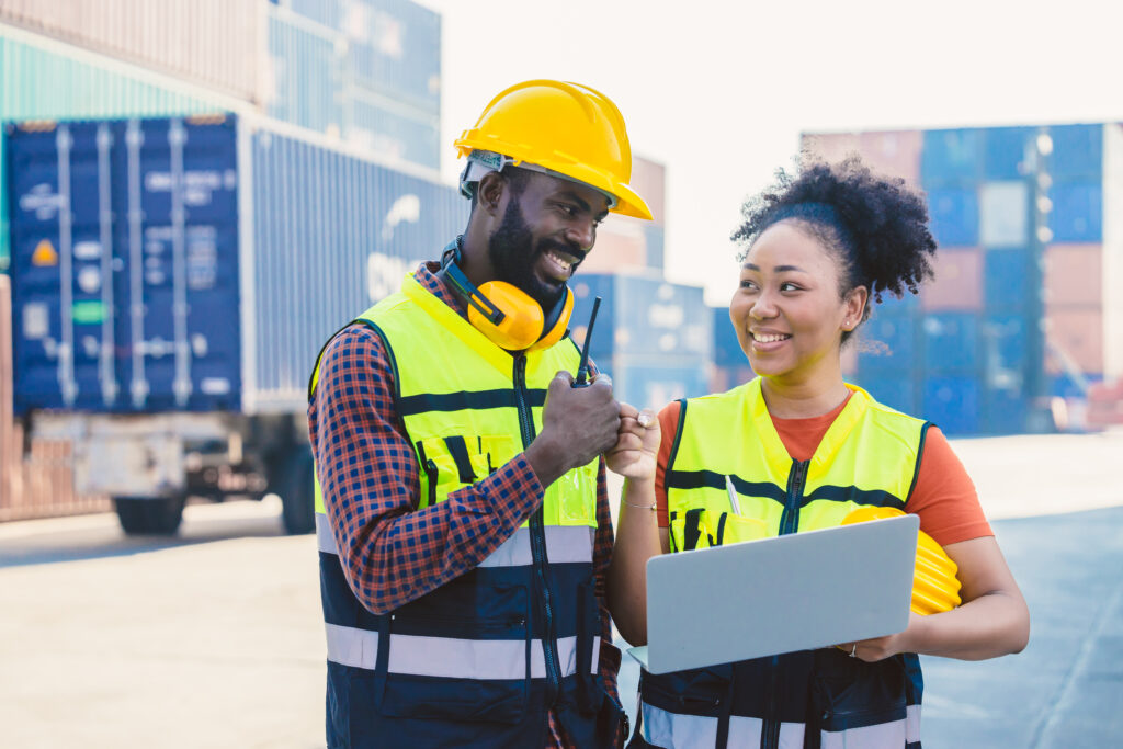 African worker teamwork happy working together inport cargo shipping industry loading container yard